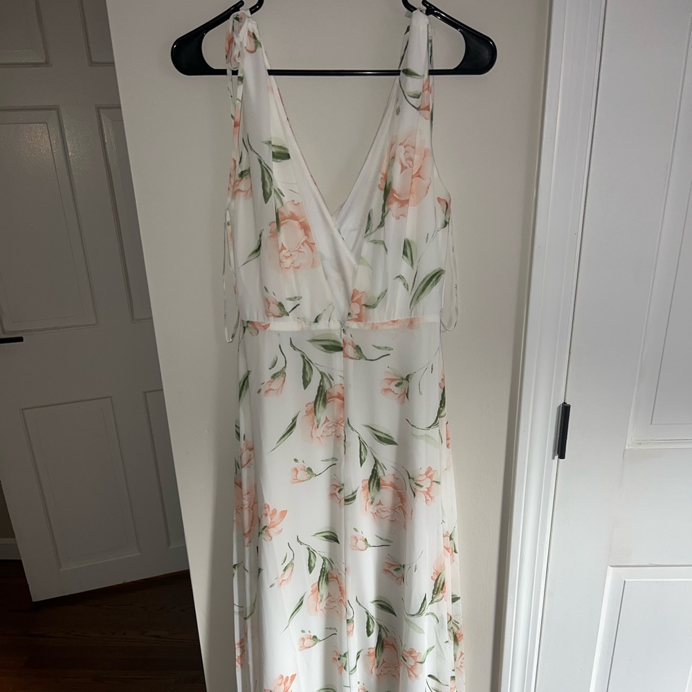 Floral, white maxi dress from Lulus. Size M, model is 5’8. Tie straps and vneck